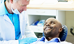 Smiling patient with the dentist.