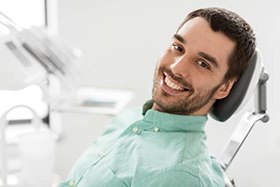 A young male patient in the dentist chair
