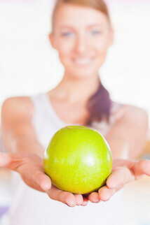 woman holding an apple