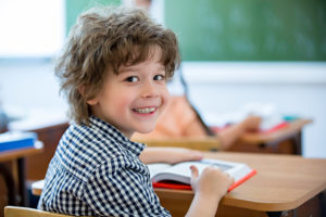 Boy smiling at school