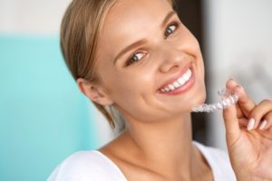 Woman holding Invisalign